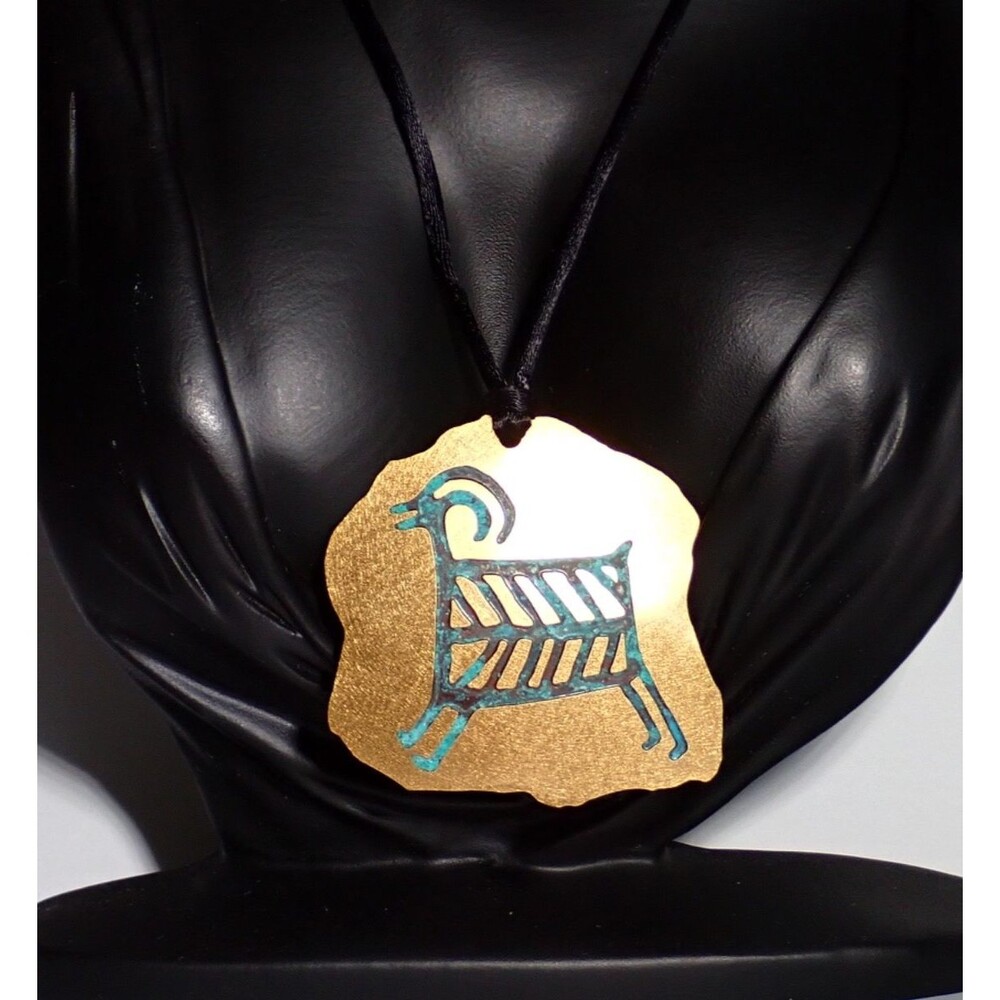 Ram Petroglyph Gold Tone Patina Pendant Necklace on Silky String Signed Meg 1996